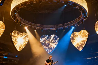Ed Sheeran performing under a circular LED halo on the Mathematics Tour